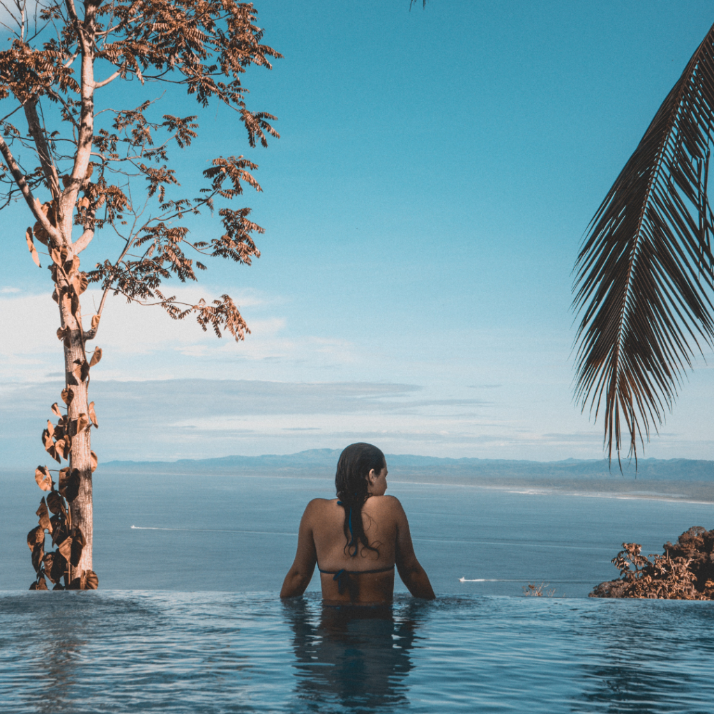 Travel influencers in swimming pool at hotel